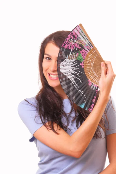 Pretty young woman with a fan — Stock Photo, Image