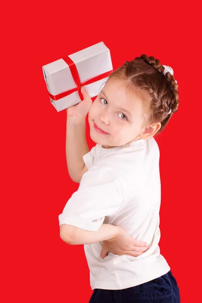 Happy little girl with a gift for Valentine 's Day — стоковое фото