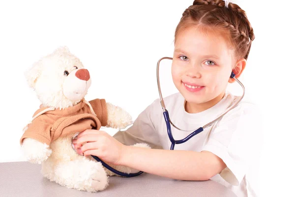 Smiling little doctor girl Stock Picture