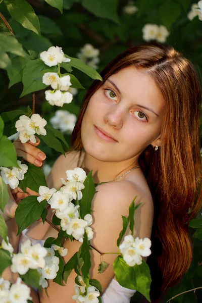 Beautiful young girl in the garden — Stock Photo, Image