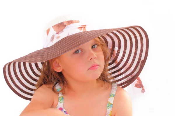 Attractive little girl in a hat — Stock Photo, Image