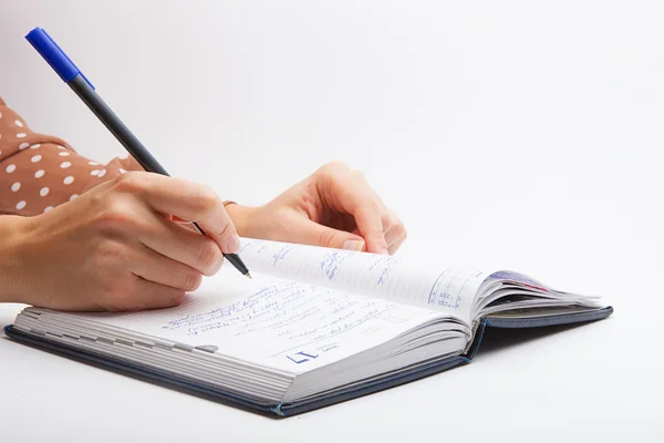 Woman Writing with pen in notepad — Stock Photo, Image