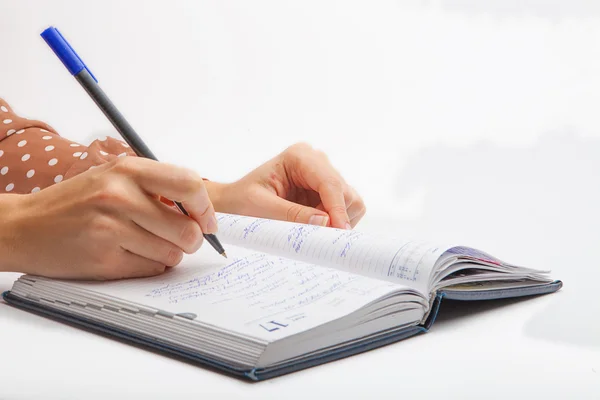 Woman Writing with pen in notepad — Stock Photo, Image
