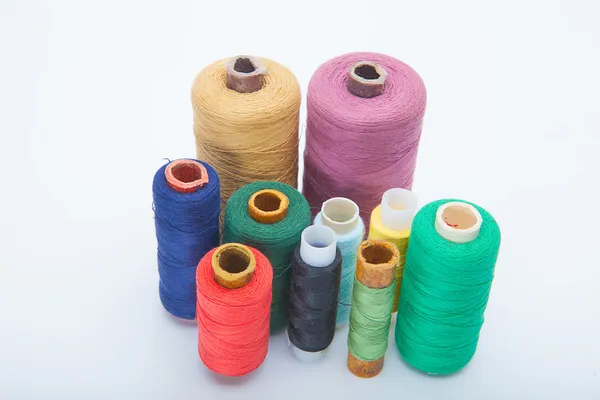 Color threads located as a rainbow — Stock Photo, Image