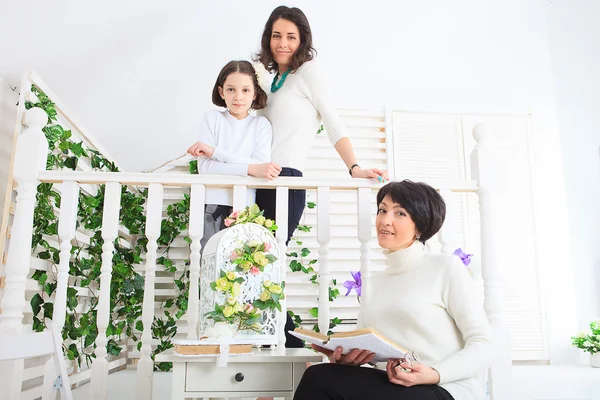 Cute little girl, her mother and grandmother together on this portrait