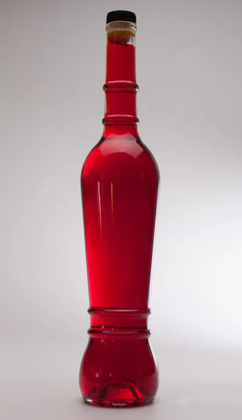 Butelka czerwony — Zdjęcie stockowe