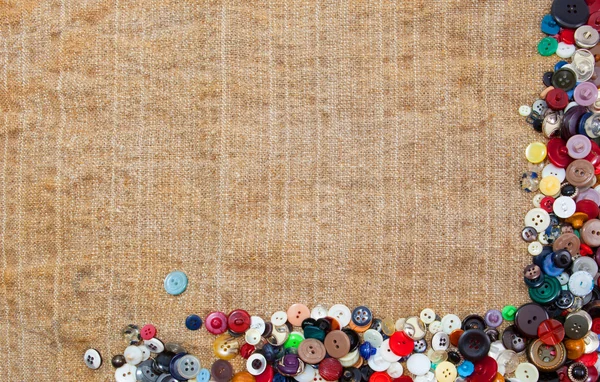 Урожай швейні гудзики обрамлення тканини фон — стокове фото