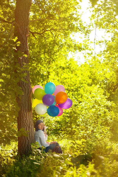 Young woman with balloons — Stock Photo, Image