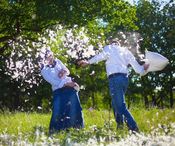 Couple having a fun pillow fight — Stock Photo, Image