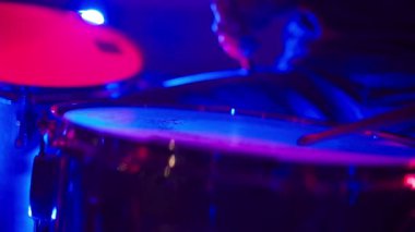 Drummer man playing drums nightclub