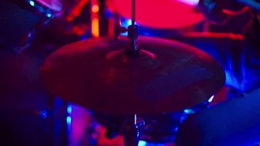 Drummer man playing drums nightclub