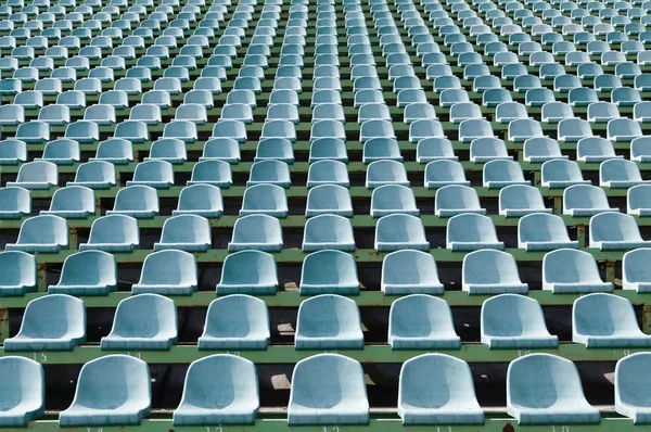 Green seats for spectators in the stadium — Stock Photo, Image