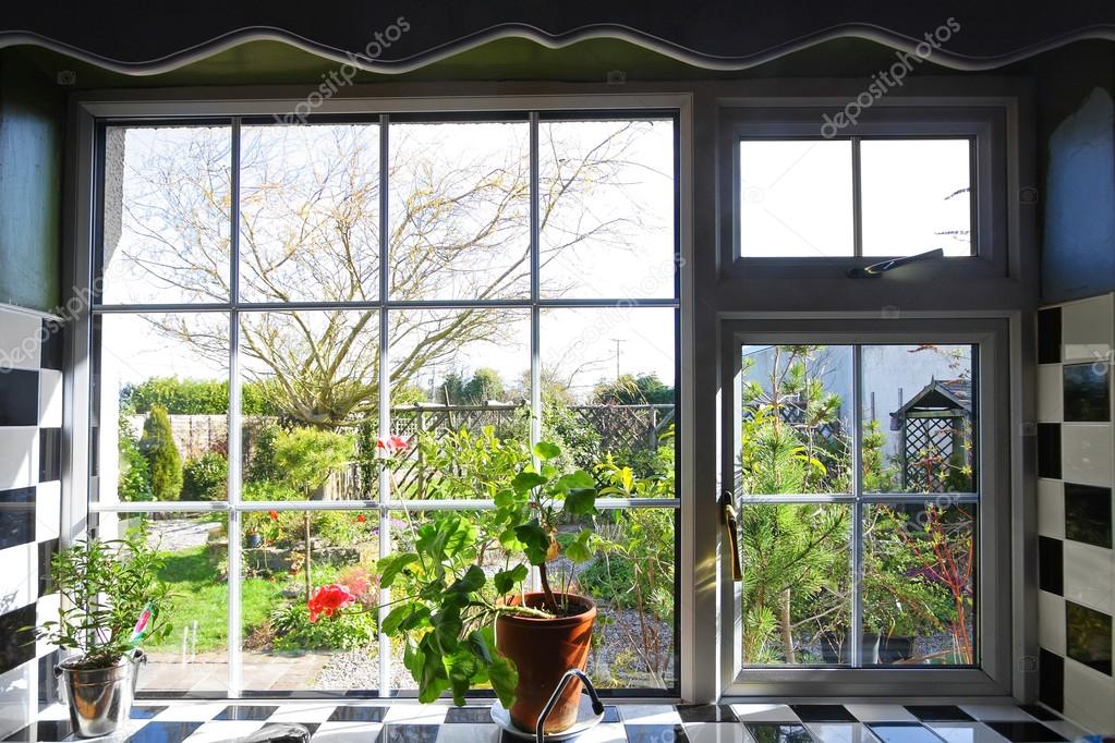 Kitchen window with the view on garden