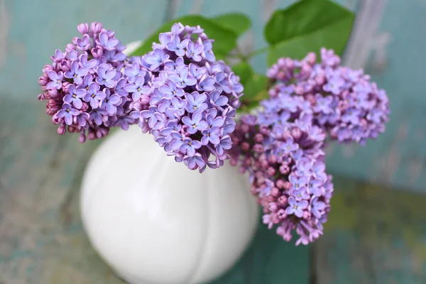 Lovely lilac in the vintage vase — Stock Photo, Image