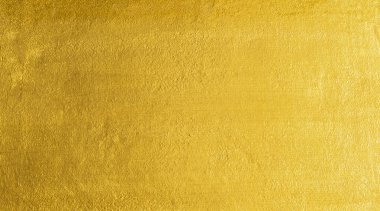 Altın duvar dokusu arka plan. Parlak ışık yansıtmalı sarı, parlak, altın folyo boya, parlak altın renkli duvar kağıdı.