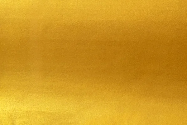 黄金の表面に明るい光の反射の黄色の箔の高級光沢のある輝きの輝きの輝きとゴールドテクスチャの背景 クリスマスの装飾の背景デザイン — ストック写真