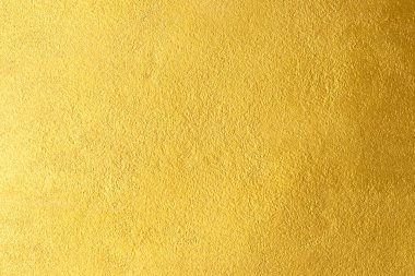 Altın duvar dokusu arka plan. Parlak ışık yansıtmalı sarı, parlak, altın folyo boya, parlak altın renkli duvar kağıdı.