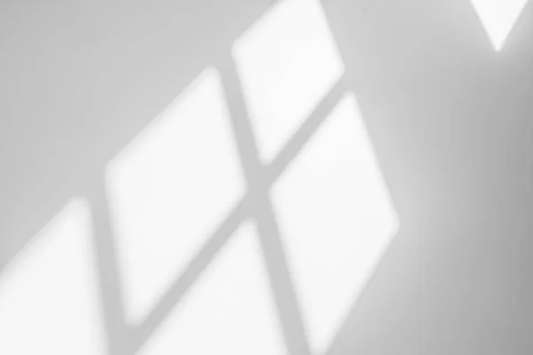 Gray shadow and light blur abstract background on white wall  from window.  Architecture stripe dark shadows indoor in room  background, monochrome, shadow overlay effect