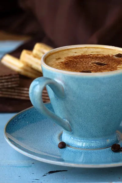 Coffee cappuccino in a trendy blue ceramic cup — Stock Photo, Image