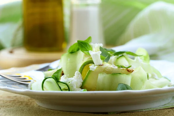 Salad of zucchini, cucumber and goat cheese — Stock Photo, Image