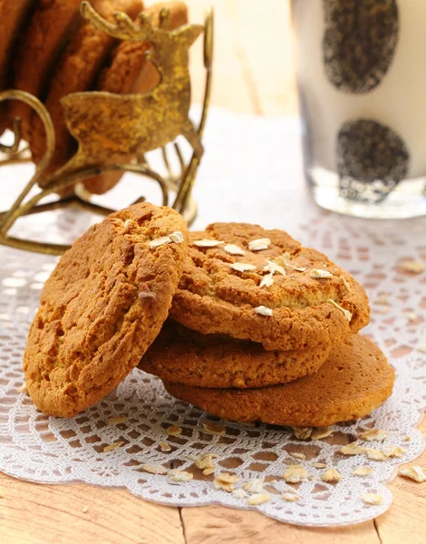 Oat cookies biscuits and a glass of milk — Stock Photo, Image