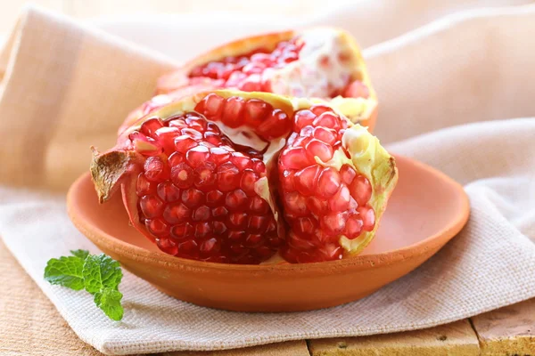 Pomegranate ripe fruit on a wooden table — Stock Photo, Image