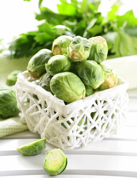 Fresh raw brussels sprouts on a wooden table — Stock Photo, Image