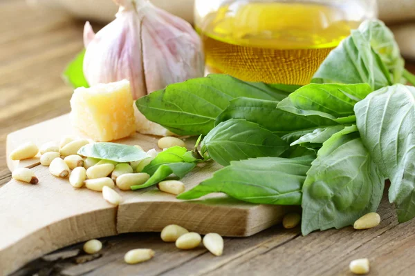 Ingredients for pesto, basil, olive oil, pine nuts, garlic and parmesan — Stock Photo, Image