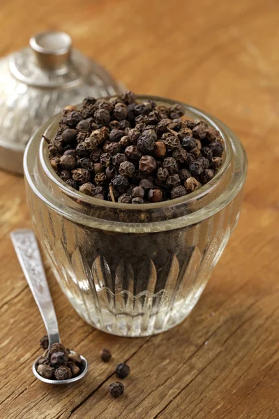 Black pepper on the board — Stock Photo, Image