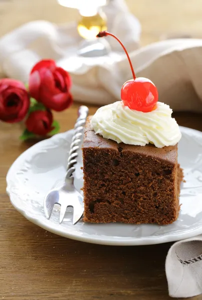 Chocolate birthday cake with cherries and whipped cream — Stock Photo, Image