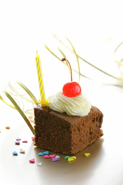 Chocolate birthday cake with cherries and whipped cream — Stock Photo, Image