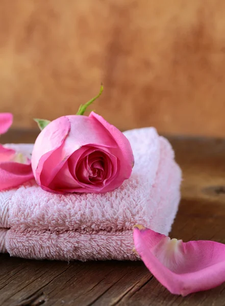 Spa concept with rose petals on a wooden background Stock Image