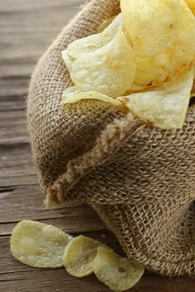 Natural organic potato chips in a linen bag — Stock Photo, Image