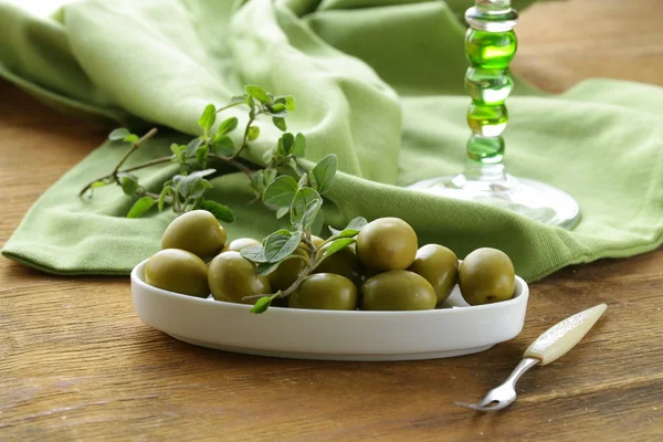 Green marinated olives with oregano — Stock Photo, Image