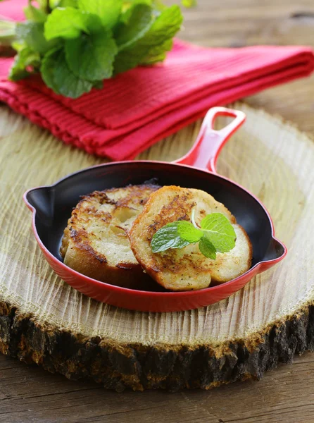 Croutons ( slice baguette) fried in a pan — Stock Photo, Image