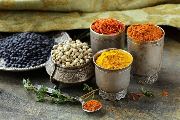 Various spices (turmeric, paprika, saffron, coriander) in metal bowls — Stock Photo, Image
