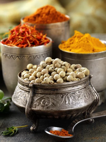 Various spices (turmeric, paprika, saffron, coriander) in metal bowls — Stock Photo, Image