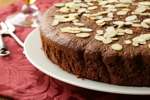 Homemade chocolate cake with almond topping — Stock Photo, Image