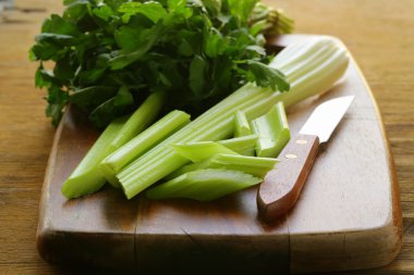 fresh chopped celery on a cutting board clipart