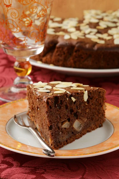 Homemade chocolate cake with almond topping — Stock Photo, Image