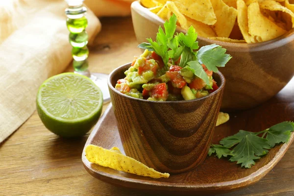 Guakomole and corn chips - avocado and tomato dip — Stock Photo, Image