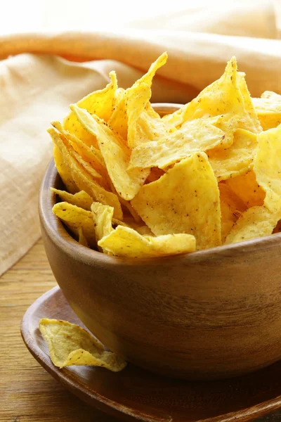 Corn tortilla chips in a wooden bowl — Stock Photo, Image