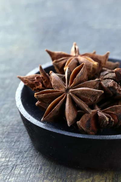Stars anise on a wood plate — Stock Photo, Image