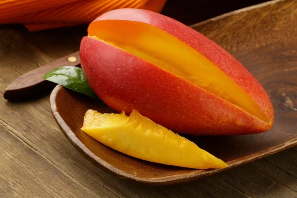 Fresh fruit mango on wooden plate — Stock Photo, Image