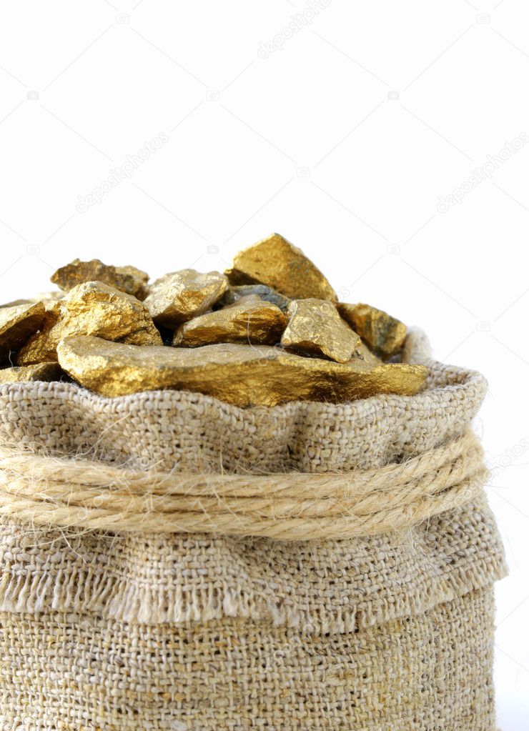 gold nuggets in a linen bag on a white background