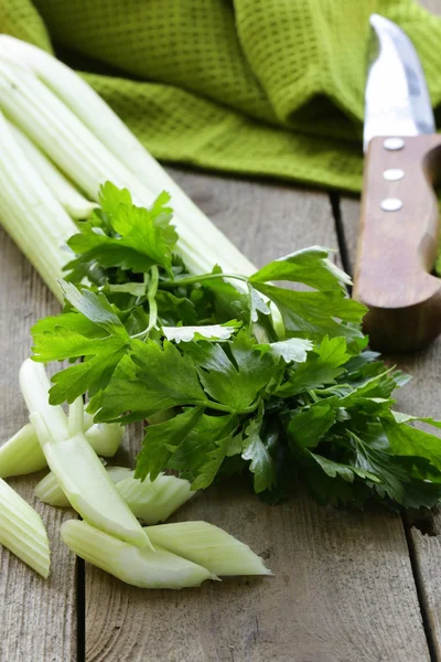 Fresh chopped celery on a wooden table — Stock Photo, Image