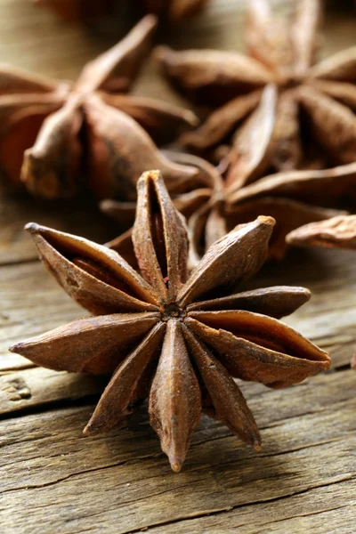Macro shot spice star anise on a wooden background — Stock Photo, Image