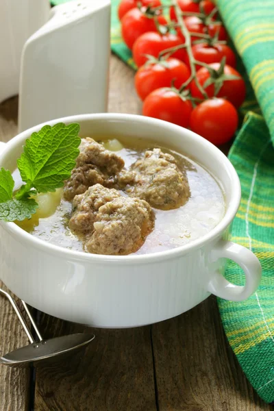 Soup with meatballs and vegetables in white bowl — Stock Photo, Image