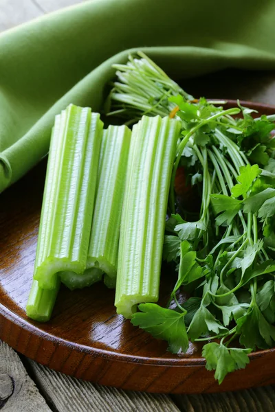 Fresh celery sticks on a wooden table, rustic style — Stock Photo, Image