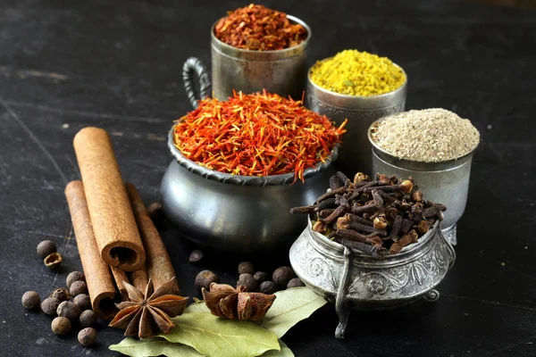 Collection of various spices (paprika, turmeric, pepper, aniseed, cinnamon, saffron) — Stock Photo, Image